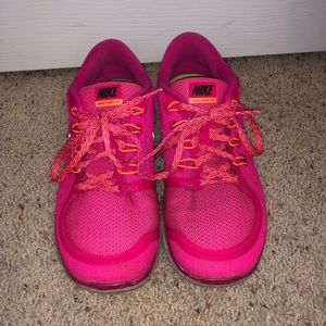 Nike pink and orange tennis shoes